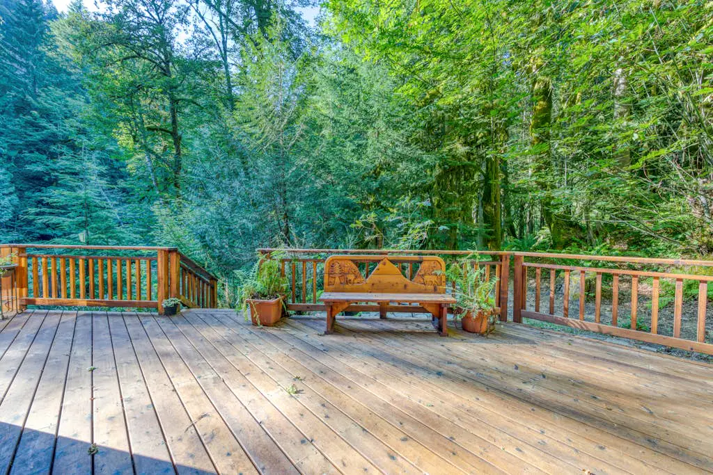 Creekside home with hot tub, deck, & great woodland views