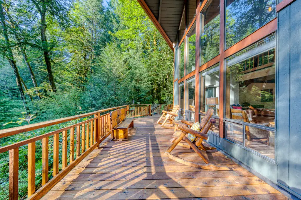 Creekside home with hot tub, deck, & great woodland views