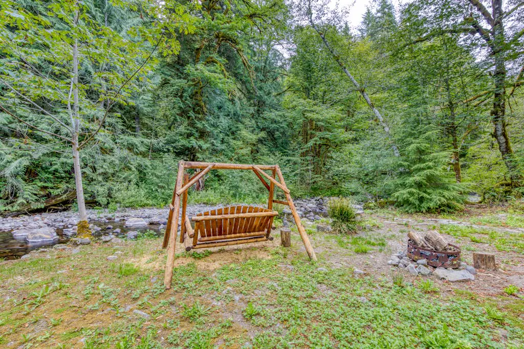 Creekside home with hot tub, deck, & great woodland views