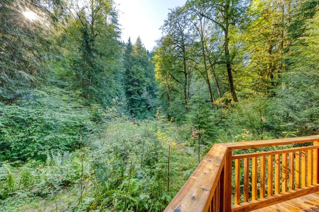 Creekside home with hot tub, deck, & great woodland views