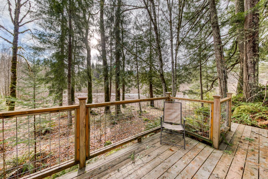 Riverfront home close to skiing & fishing with beach access & huge VHS library