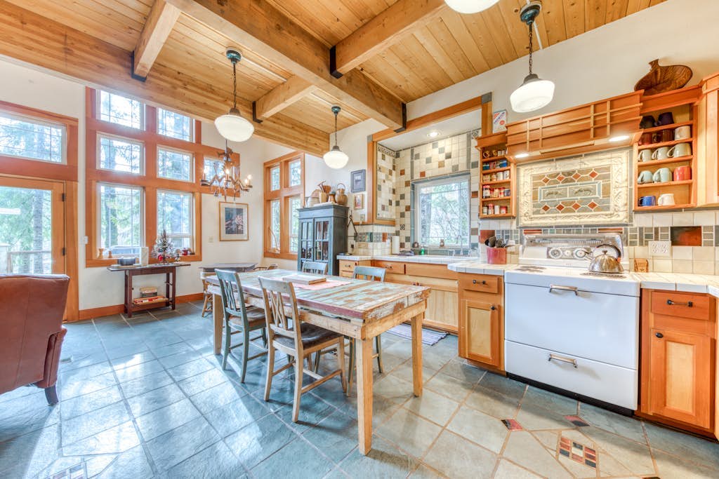 Riverfront home close to skiing & fishing with beach access & huge VHS library