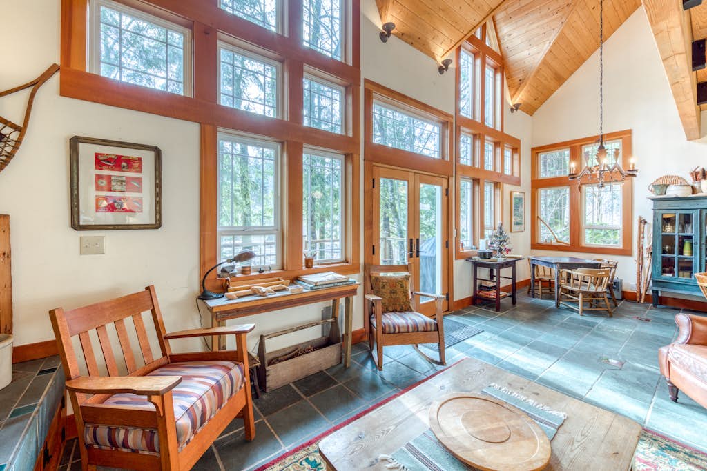 Riverfront home close to skiing & fishing with beach access & huge VHS library