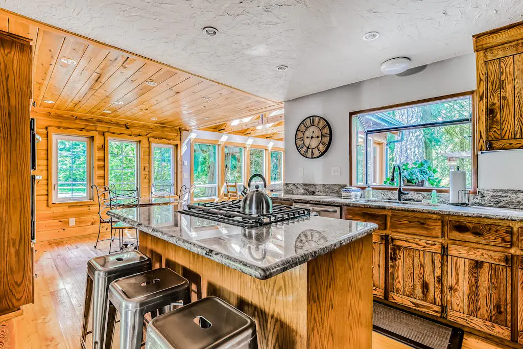Dog-friendly creekside home with entertainment barn, private hot tub & firepit