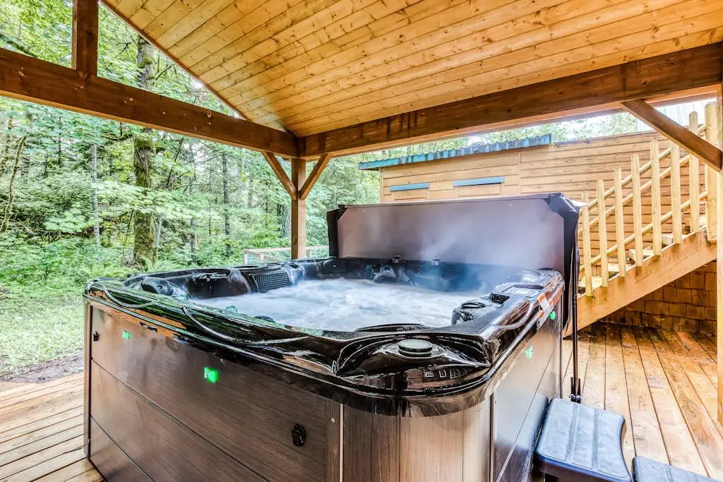 Dog-friendly creekside home with entertainment barn, private hot tub & firepit
