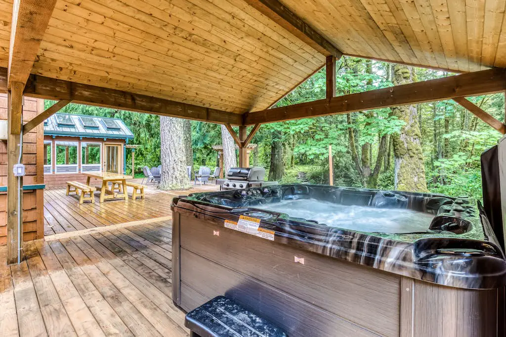 Dog-friendly creekside home with entertainment barn, private hot tub & firepit