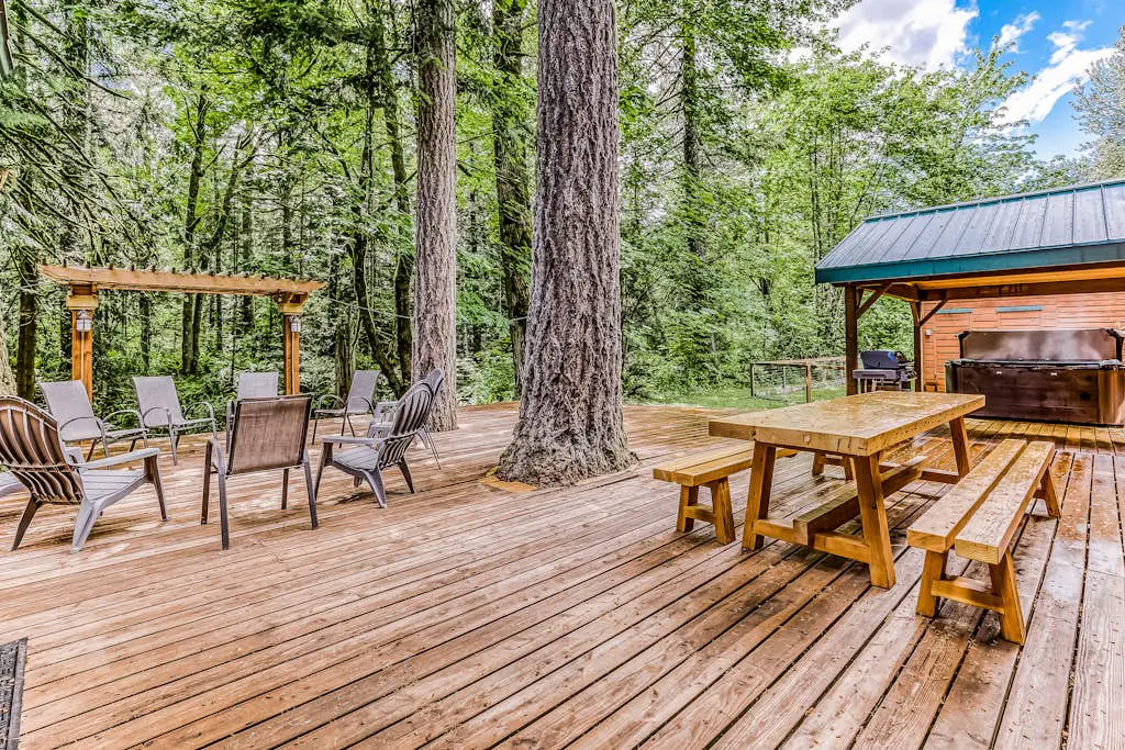 Dog-friendly creekside home with entertainment barn, private hot tub & firepit