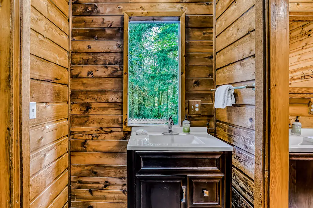 Dog-friendly creekside home with entertainment barn, private hot tub & firepit