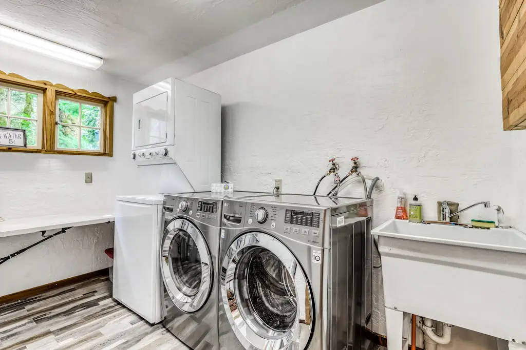 Dog-friendly creekside home with entertainment barn, private hot tub & firepit