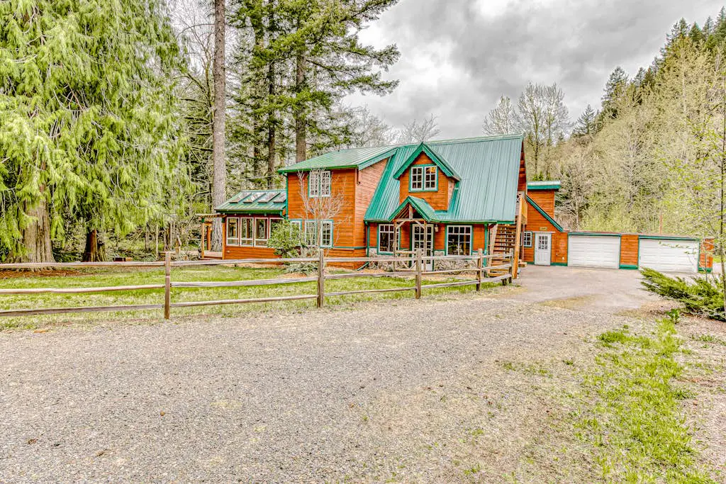Dog-friendly creekside home with entertainment barn, private hot tub & firepit