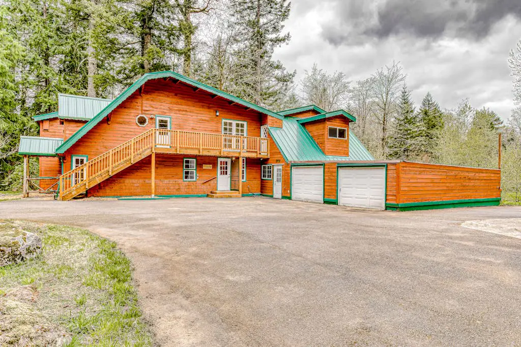 Dog-friendly creekside home with entertainment barn, private hot tub & firepit