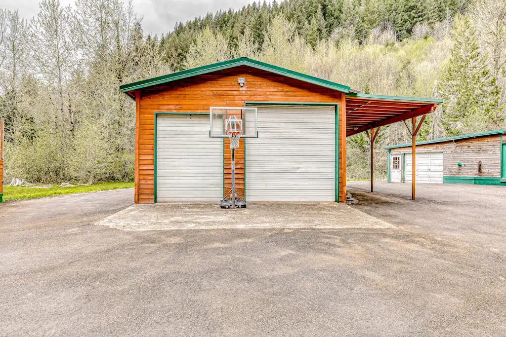 Dog-friendly creekside home with entertainment barn, private hot tub & firepit