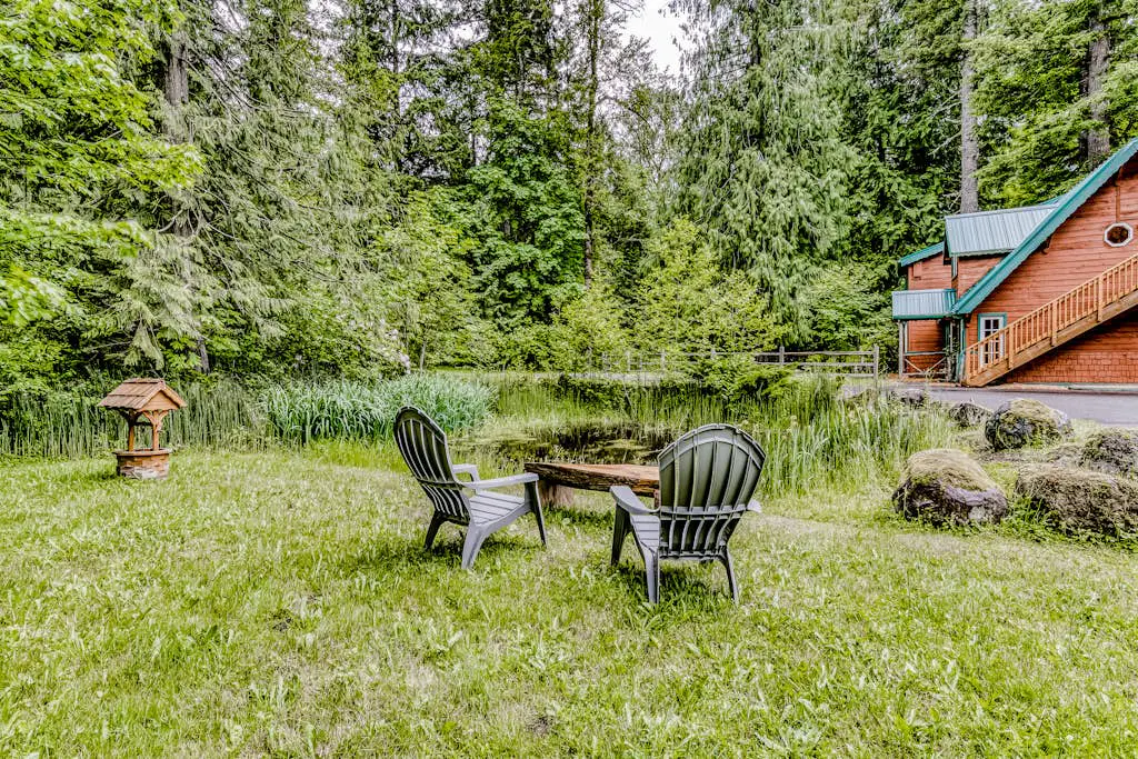 Dog-friendly creekside home with entertainment barn, private hot tub & firepit
