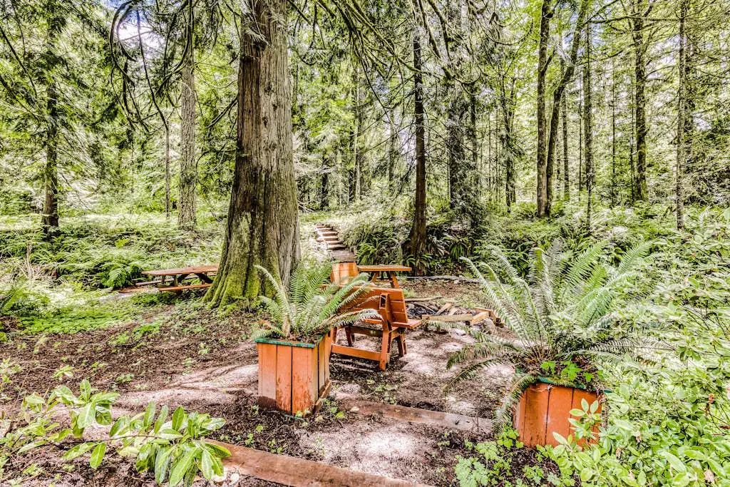 Dog-friendly creekside home with entertainment barn, private hot tub & firepit