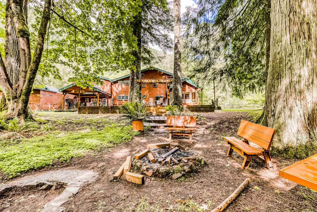 Dog-friendly creekside home with entertainment barn, private hot tub & firepit