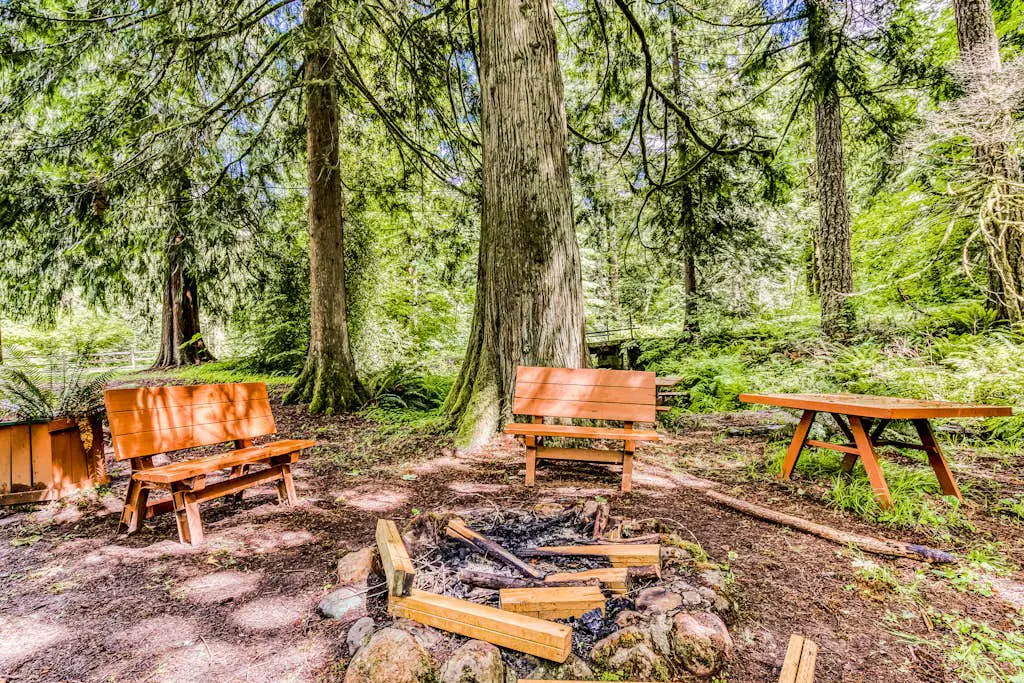 Dog-friendly creekside home with entertainment barn, private hot tub & firepit