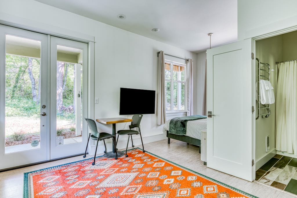 Dog-friendly studio with river view, patio, grill, & shared W/D