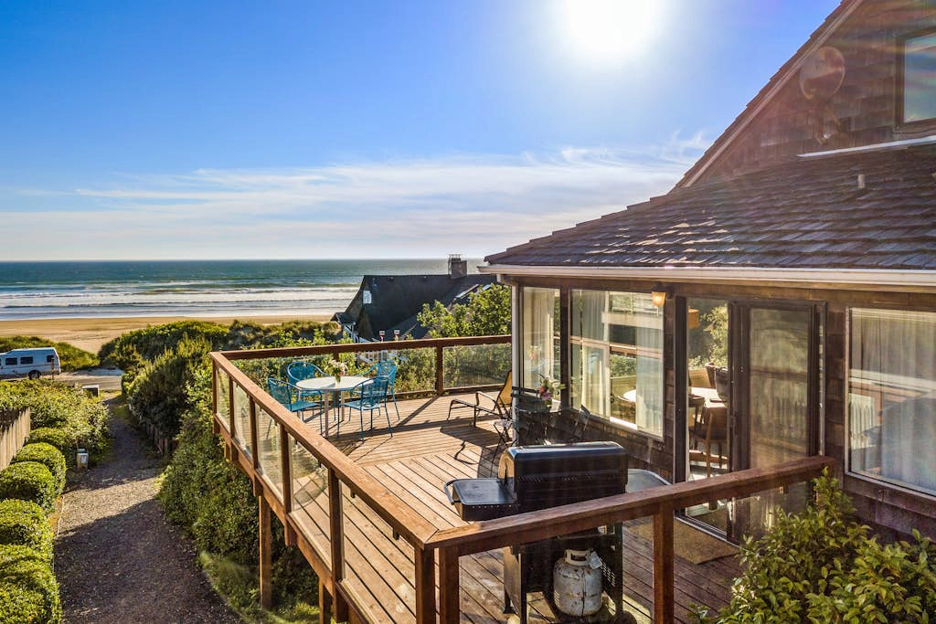 3-story dog-friendly beachfront home with wood stove, gas grill, deck & views