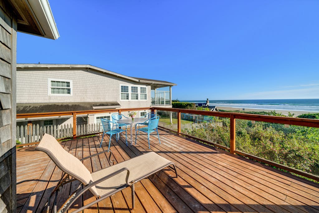 3-story dog-friendly beachfront home with wood stove, gas grill, deck & views