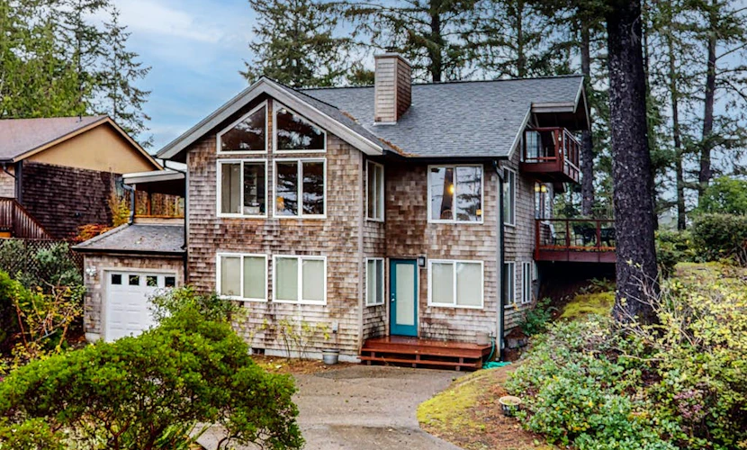 Spacious 3-story home near the beach with water views, grill, deck, & firepit