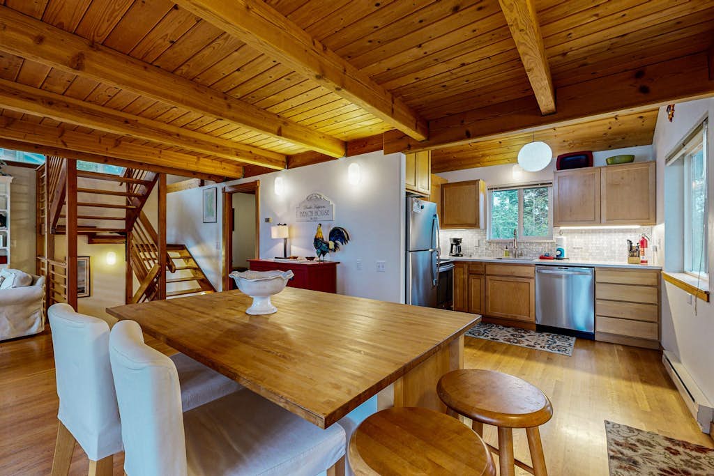 Spacious 3-story home near the beach with water views, grill, deck, & firepit
