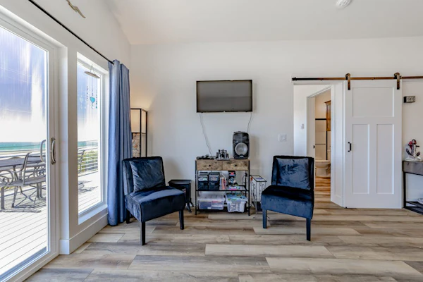 Dog-friendly oceanside home w/WiFi, ocean views, private W/D, deck, & fireplace