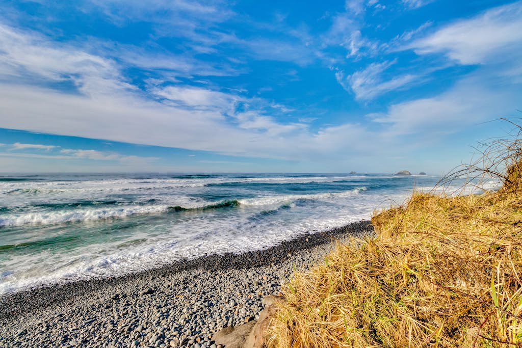 Charming home with ocean views, patio, BBQ grill, WiFi, W/D, walk to beach