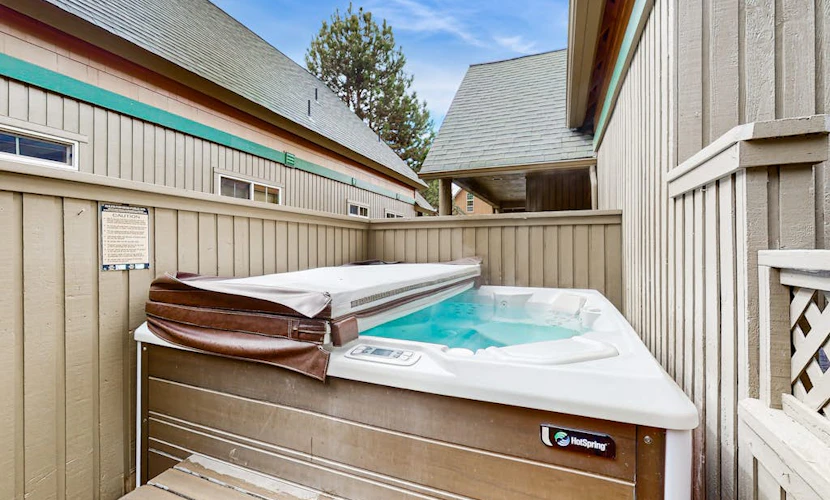Log decor home with private hot tub, deck & shared pools & tennis