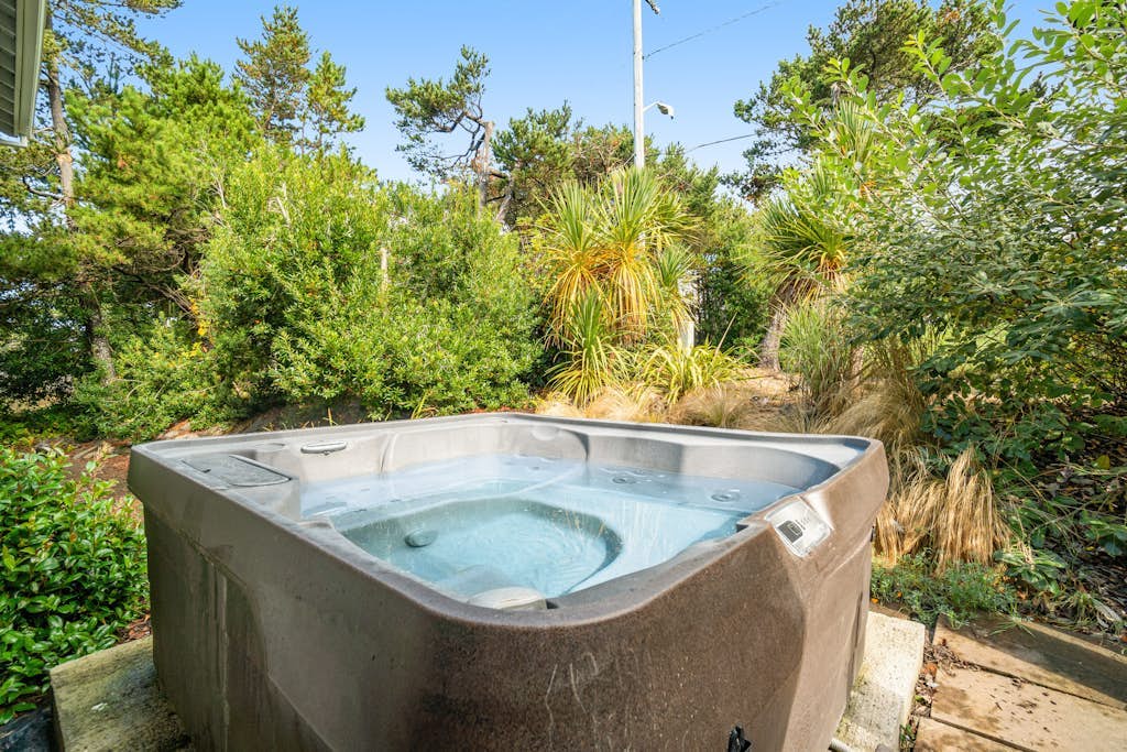 Newly updated, dog-friendly house near the beach with hot tub & grill