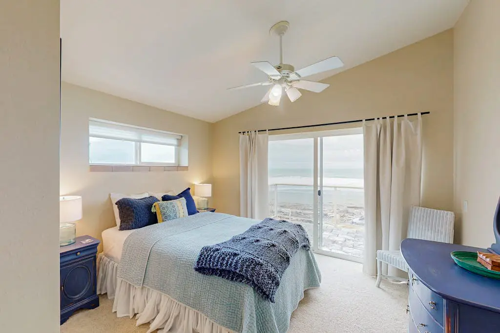 Modern oceanfront home with private hot tub, patio, & gas fireplace