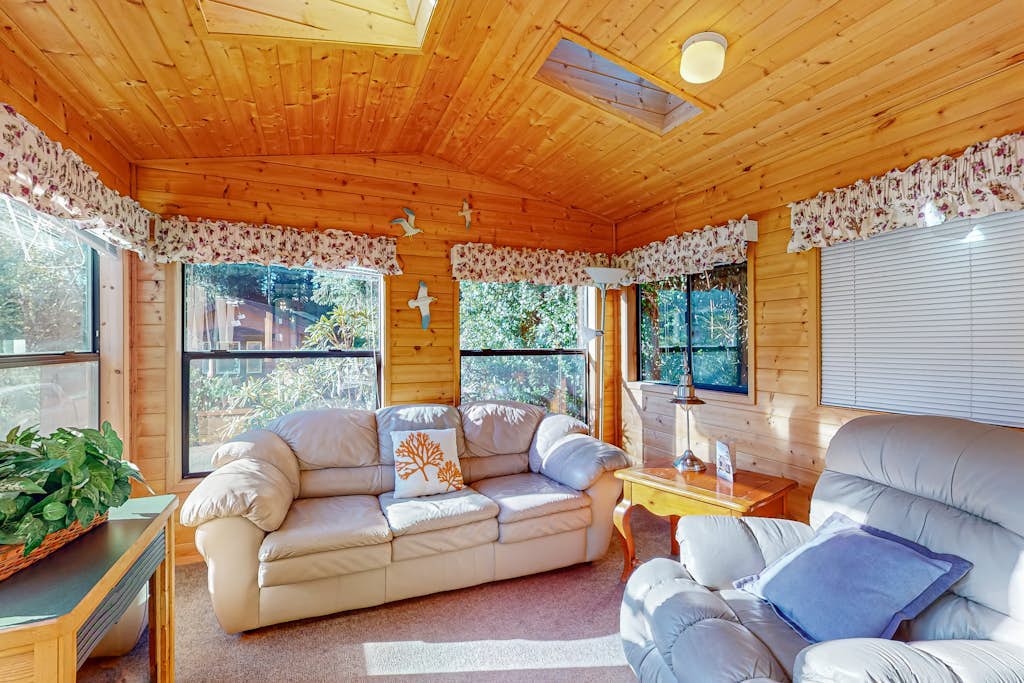 Cozy abode steps from the beach with a private hot tub and nautical theme