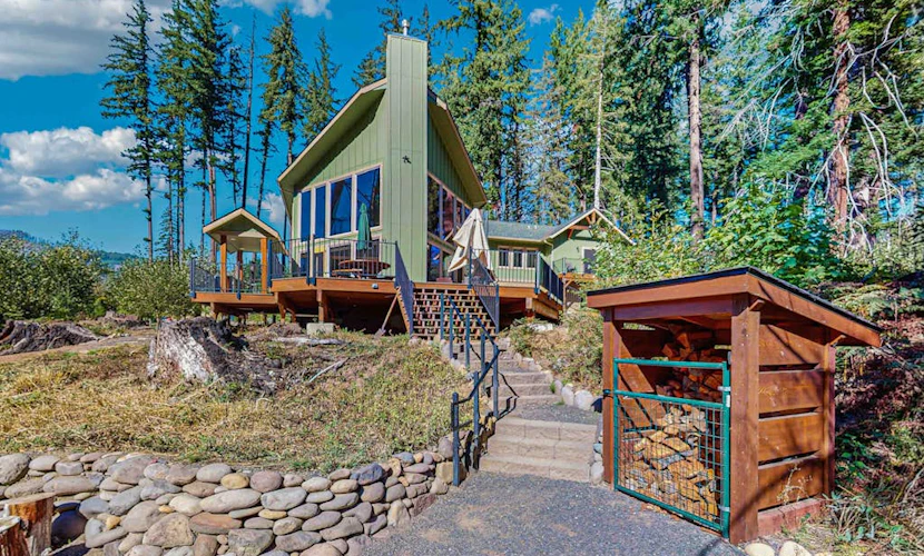Unique riverfront home + cabin with amazing views, deck, & W/D - dog-friendly