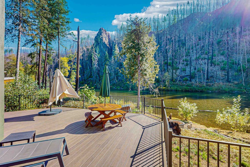 Unique riverfront home + cabin with amazing views, deck, & W/D - dog-friendly