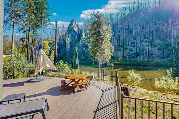 Unique riverfront home + cabin with amazing views, deck, & W/D - dog-friendly