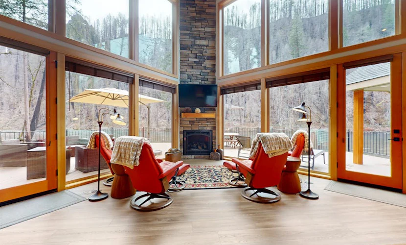 Fully rebuilt riverfront home with deck, fireplace, & W/D - dog-friendly