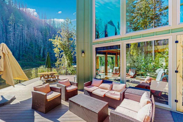 Fully rebuilt riverfront home with deck, fireplace, & W/D - dog-friendly