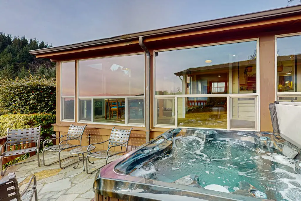 Oceanfront home with private hot tub, walls of glass & spectacular view