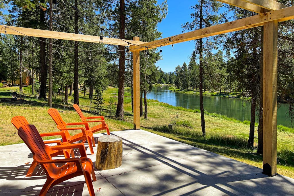 Quaint, riverfront home with woodstove, patio, deck, board games & washer/dryer