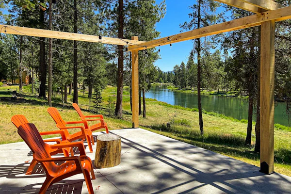 Quaint, riverfront home with woodstove, patio, deck, board games & washer/dryer