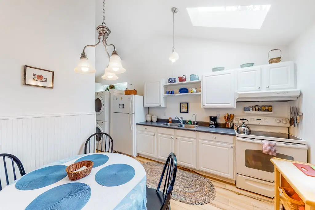 Dog-Friendly Getaway with Outdoor Firepit & Balcony - Steps from Beach Access
