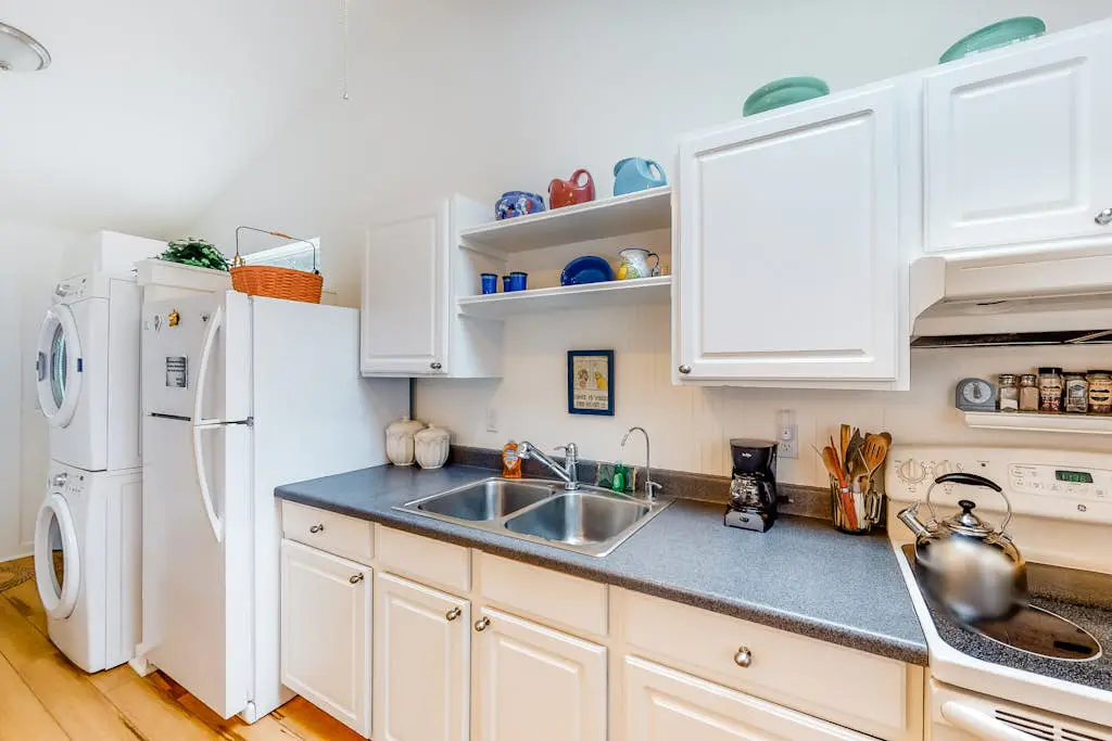 Dog-Friendly Getaway with Outdoor Firepit & Balcony - Steps from Beach Access