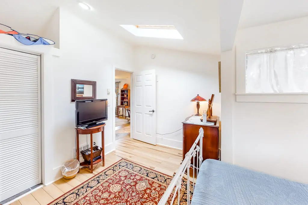 Dog-Friendly Getaway with Outdoor Firepit & Balcony - Steps from Beach Access