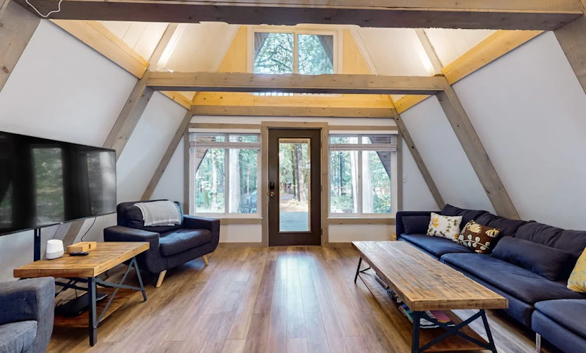 Dog-friendly A-frame near the river with game room, firepit, wood stove, & grill