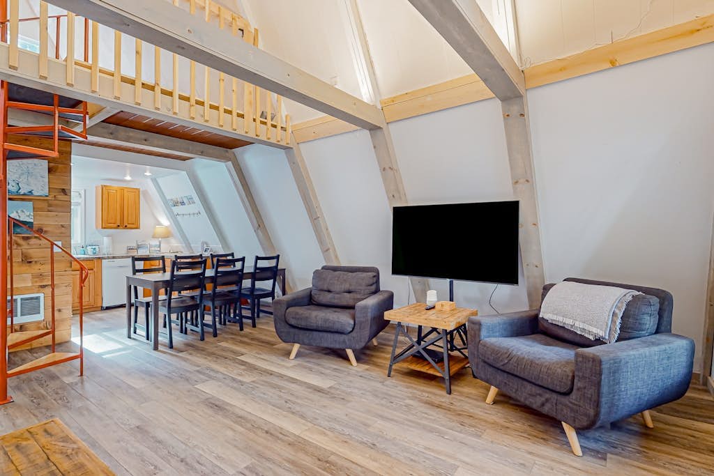 Dog-friendly A-frame near the river with game room, firepit, wood stove, & grill