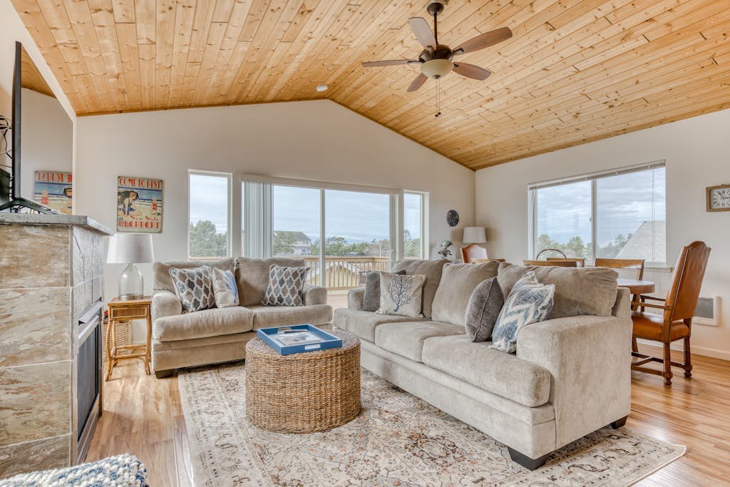 Serene riverfront home with gas fireplace, W/D, balcony, patio, & board games