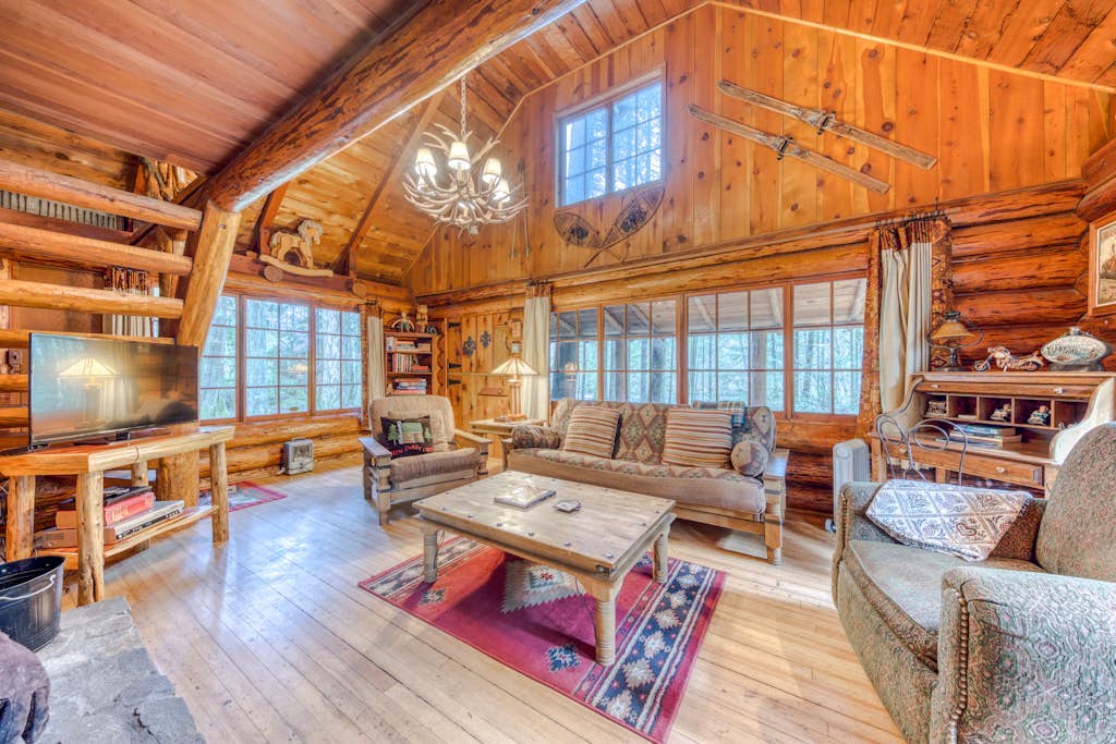 Historic riverfront Steiner cabin in forest with firepit, deck, & patio lounging