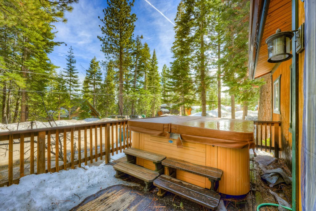 Dog-friendly cabin with private hot tub, fireplace, near skiing & the beach