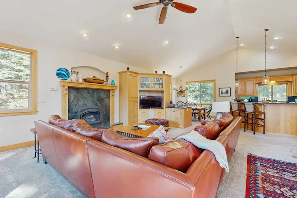 Gorgeous family home surrounded by trees w/ a furnished deck & BBQ