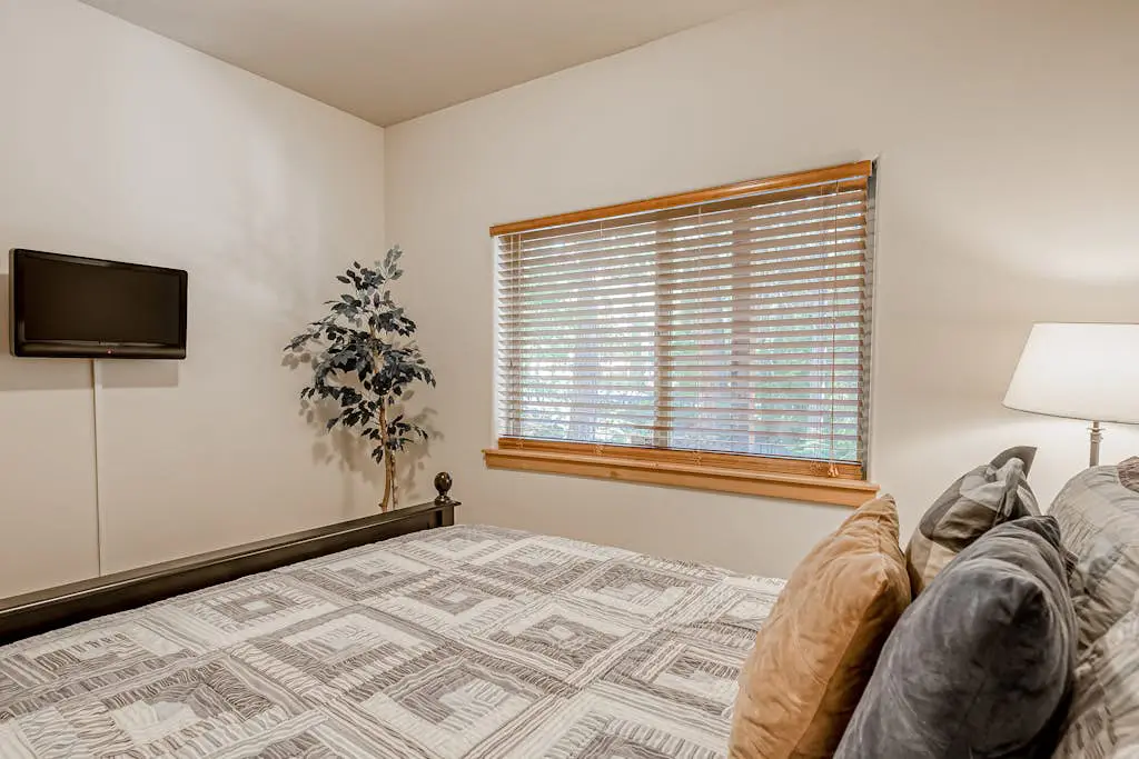 Inviting spacious home with fireplace, deck, hot tub, full kitchen, & W&D