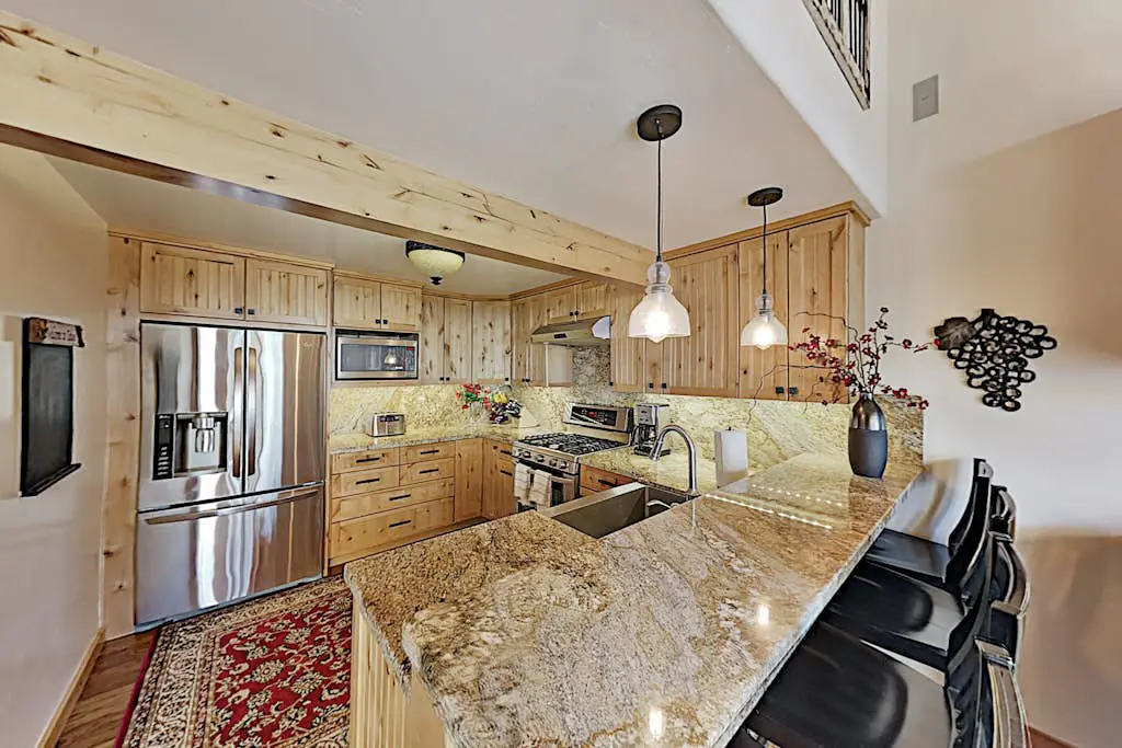 Custom, luxe condo with panoramic lake & mountain views & fireplaces